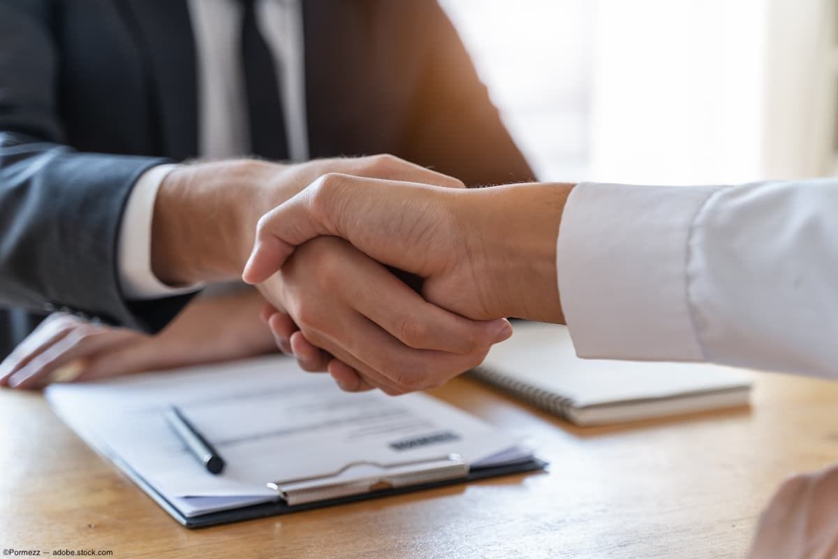 Two people shaking hands over a contract or agreement (Image credit: AdobeStock/Pormezz)